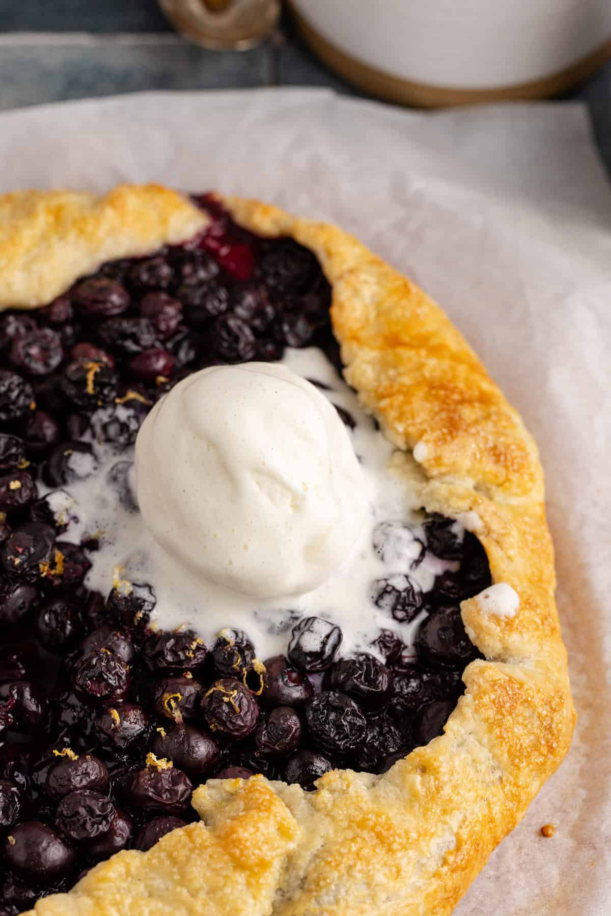 Blueberry Galette close up with ice cream on it