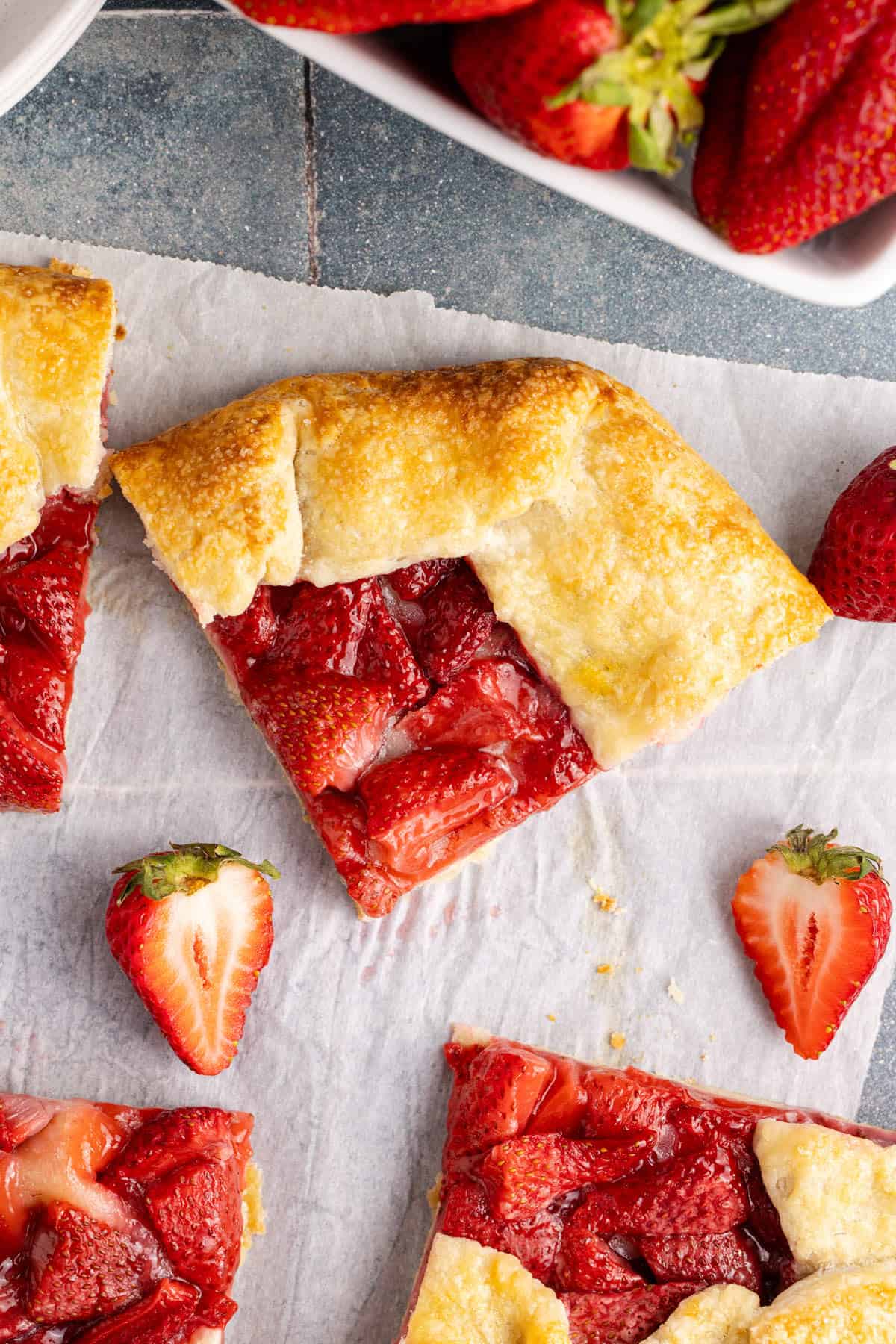 Strawberry Galette slices with strawberries around