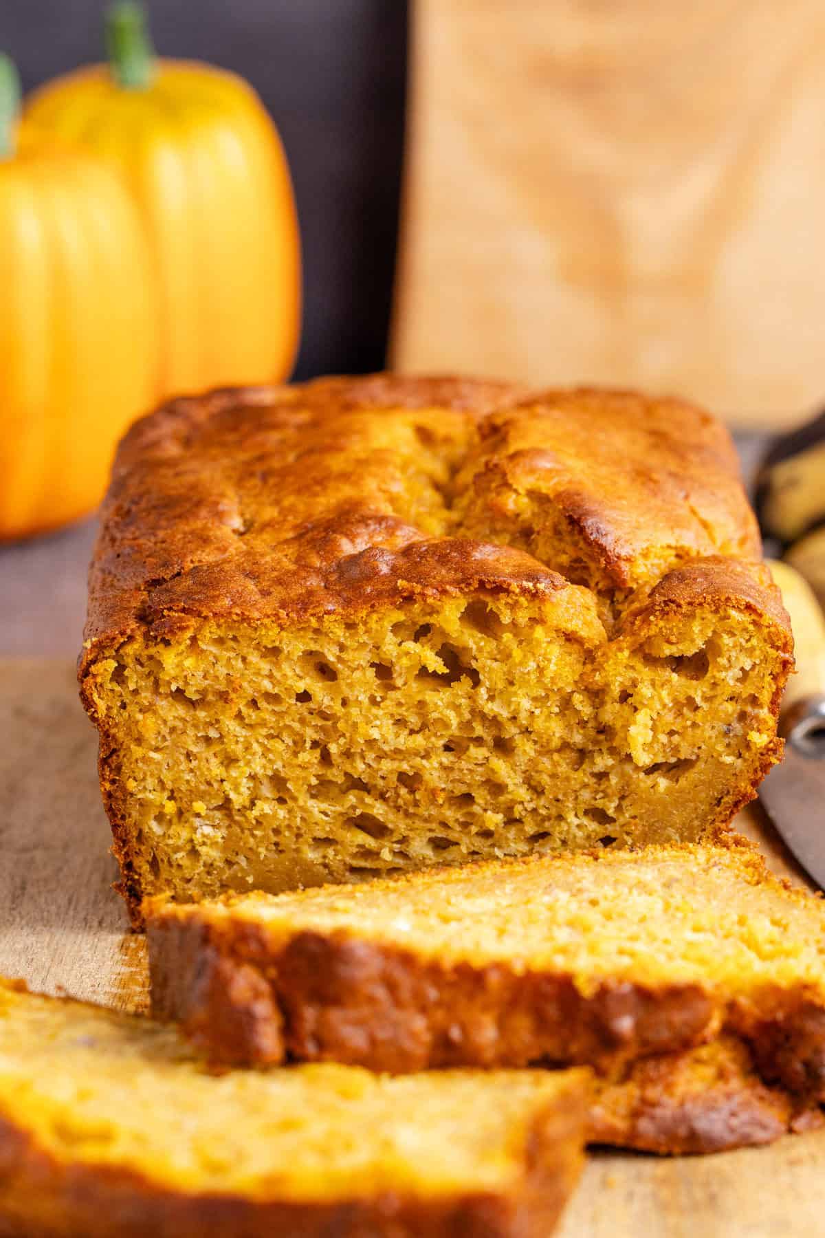 Pumpkin Banana Bread on a Cutting Board a slice in front