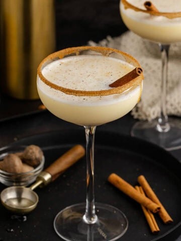 Eggnog Martini Cocktail Garnished with Cinnamon Stick