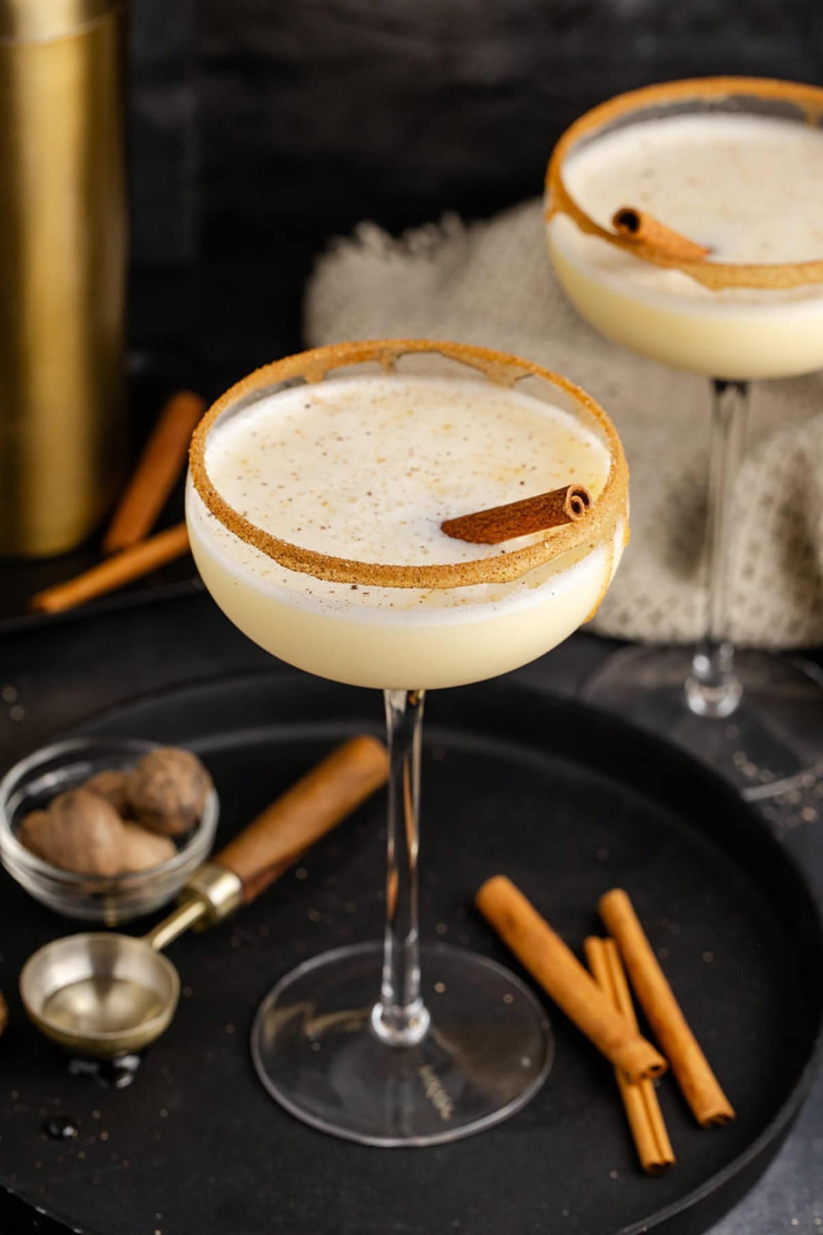 Eggnog Martini Cocktail Garnished with Cinnamon Stick