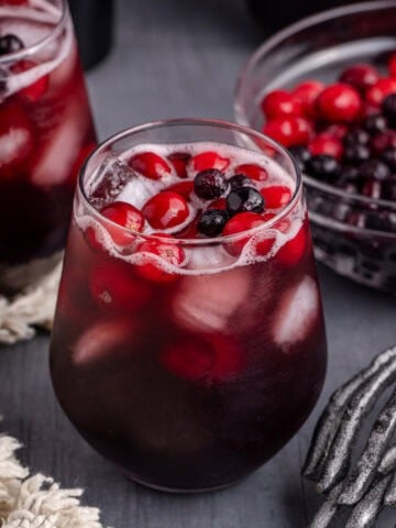 Halloween Sangria with cranberries and blueberries on top