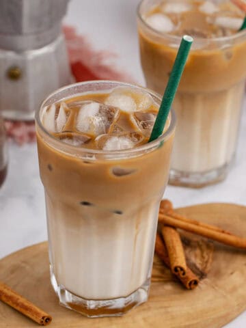 Iced Apple Crisp Oat Milk Macchiato Served Over Ice with a Straw
