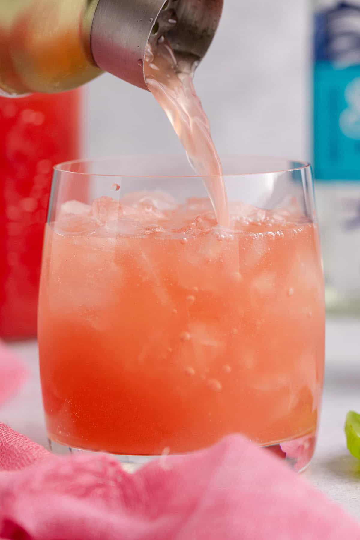 Watermelon Basil Margarita being poured into a lowball glass
