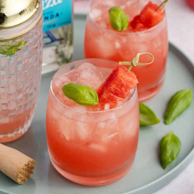 Watermelon Basil Margarita close up from above with watermelon and basil garnish