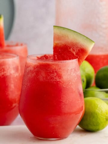 Watermelon Vodka Cocktail Served in a Stemless Wine Glass and Watermelon Wedge Garnish