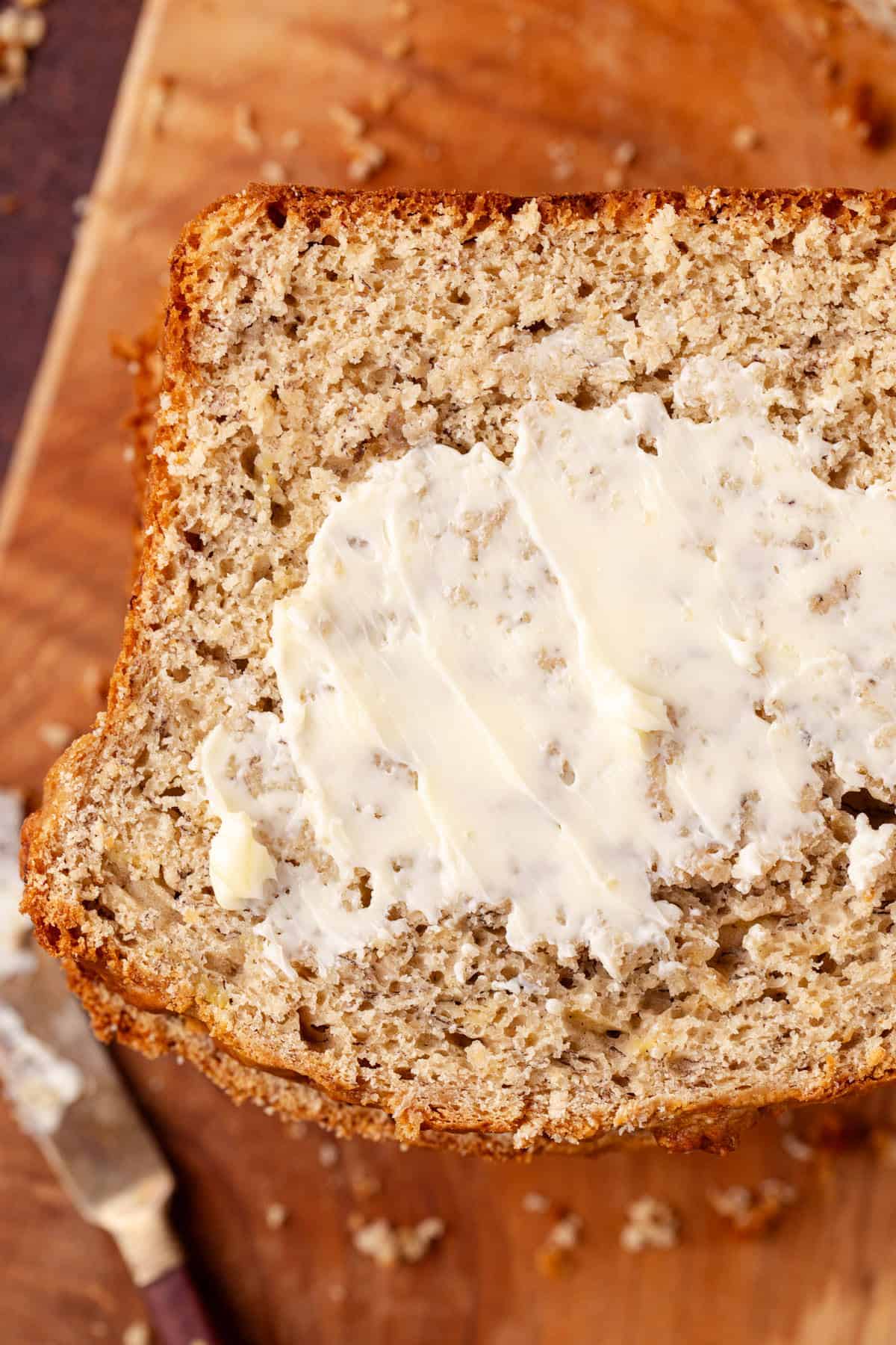 4 Ingredient Banana Bread close up with butter on it