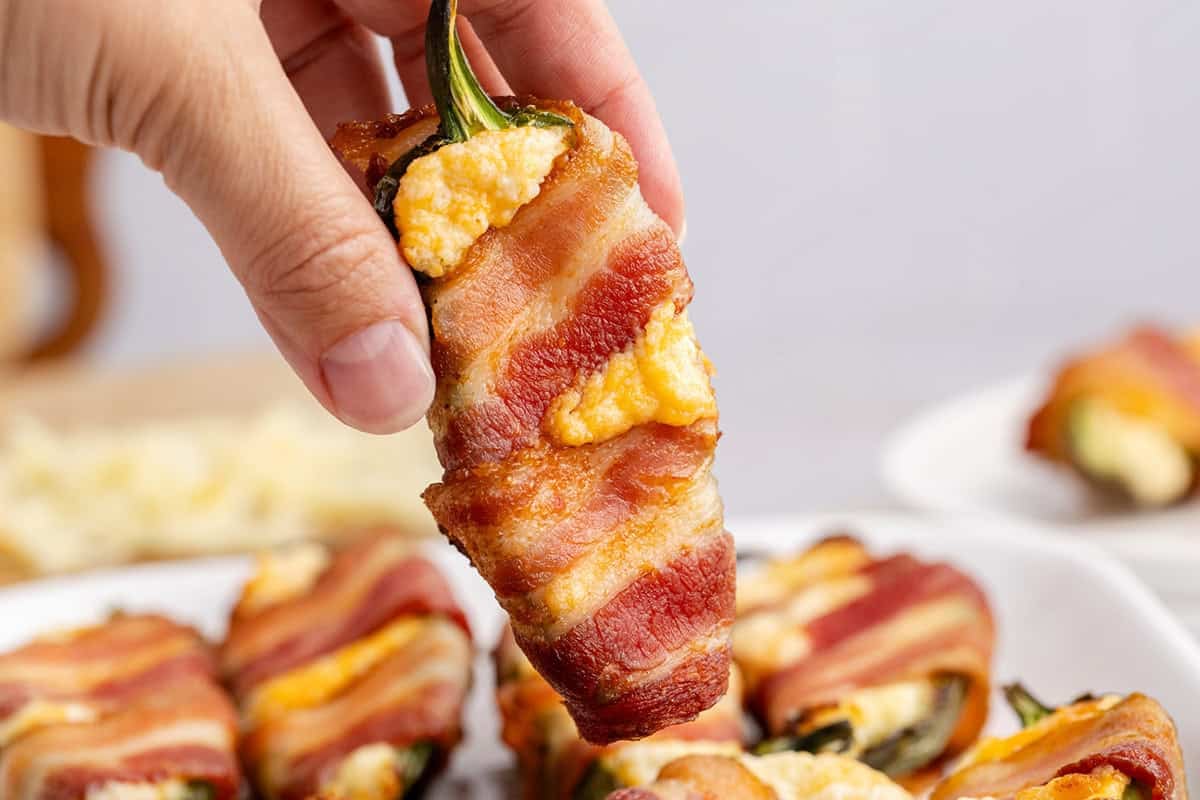 Bacon Wrapped Jalapeno Poppers being held