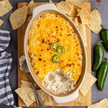 Baked Jalapeno Popper Dip close up with a scoop missing