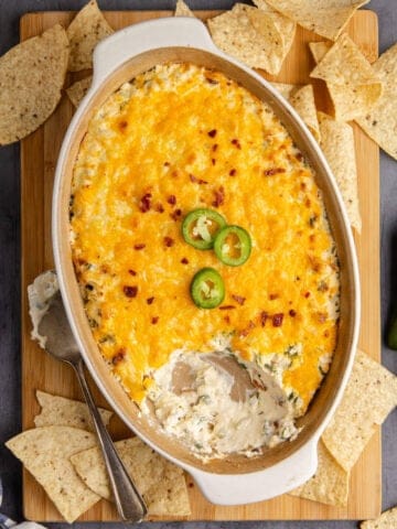 Baked Jalapeno Popper Dip close up with a scoop missing