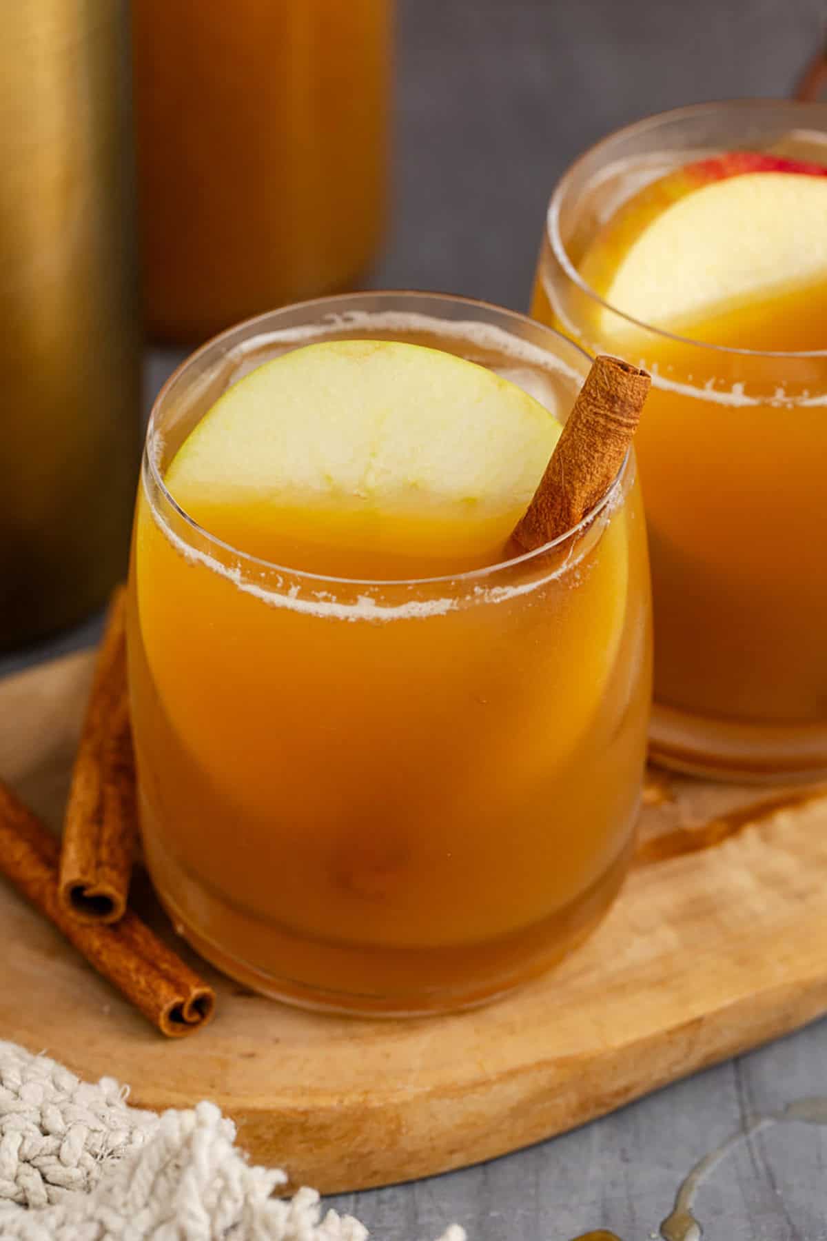 Bourbon Apple Cider Cocktails close up on a cutting board