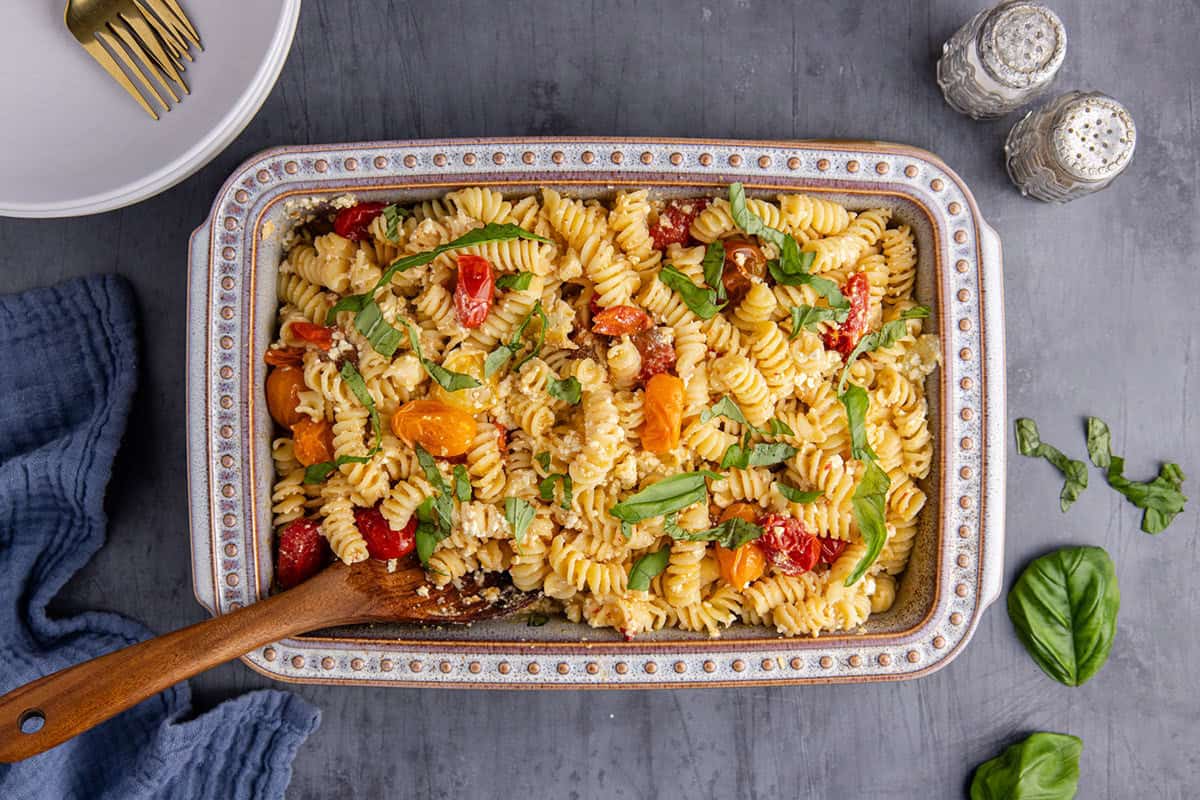 Feta Pasta Recipe Baked in Casserole Dish Topped with Fresh Basil