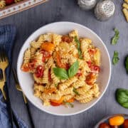 Feta Pasta Recipe Plated and Garnished with Fresh Basil