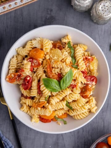 Feta Pasta Recipe Plated and Garnished with Fresh Basil