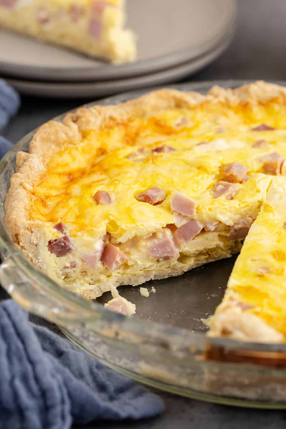Ham and Swiss Quiche in a Pie Plate with One Slice Removed