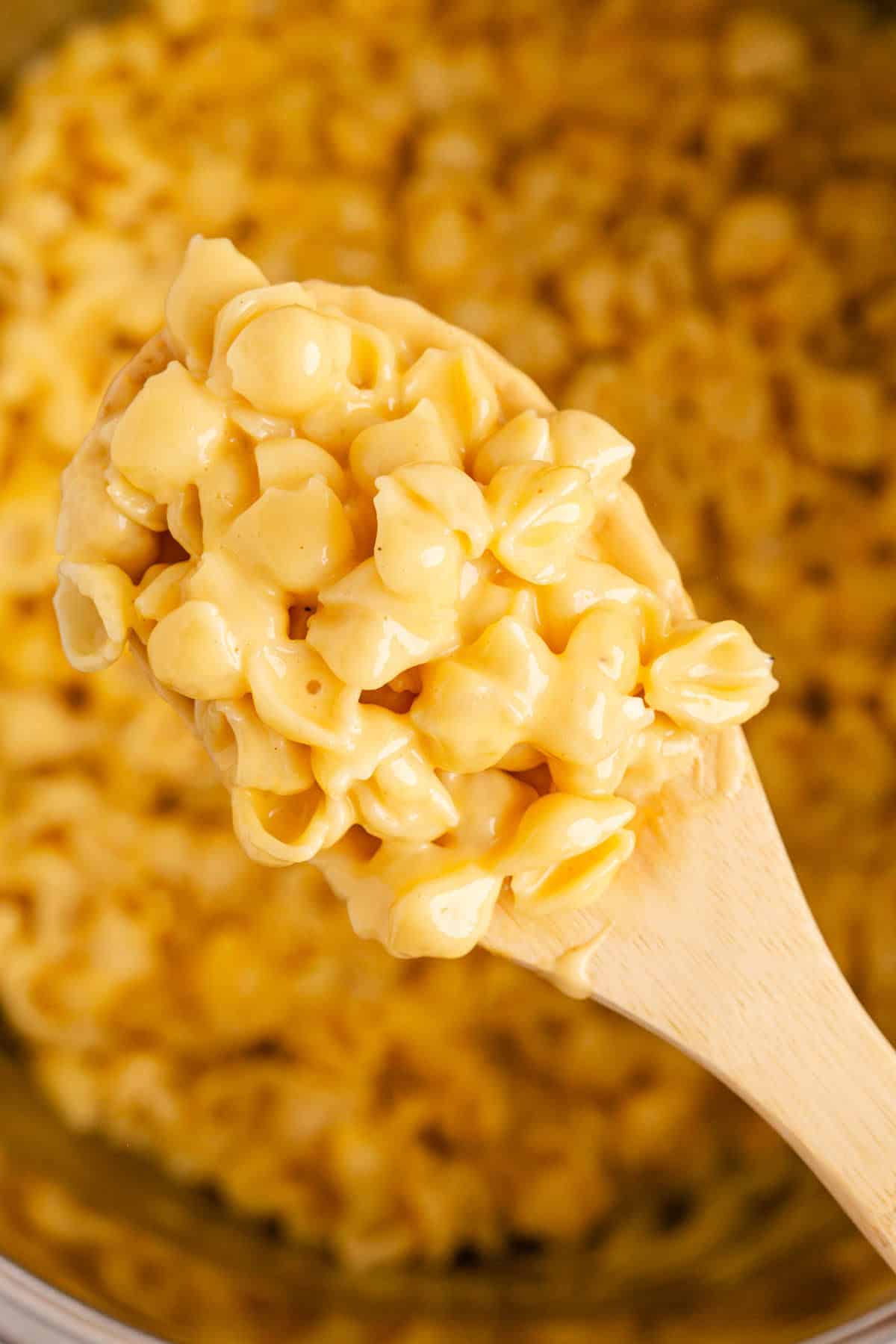 Instant Pot Mac and Cheese Velveeta on a Wooden Spoon Scooped from Instant Pot