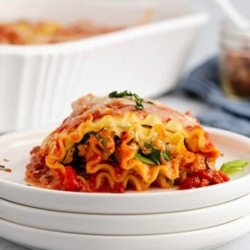 Plated Side View of Spinach Lasagna Roll Ups Showing Layers