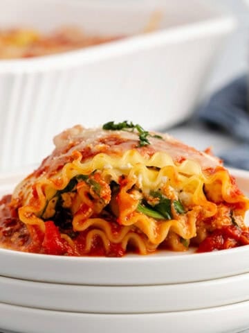 Plated Side View of Spinach Lasagna Roll Ups Showing Layers