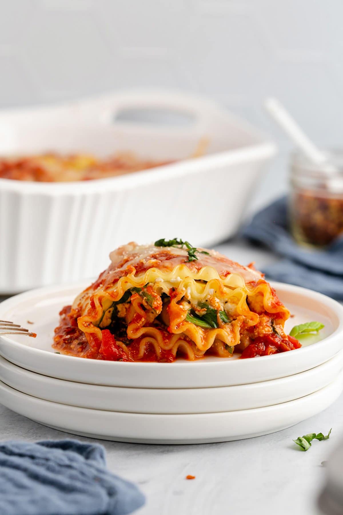 Plated Side View of Spinach Lasagna Roll Ups Showing Layers