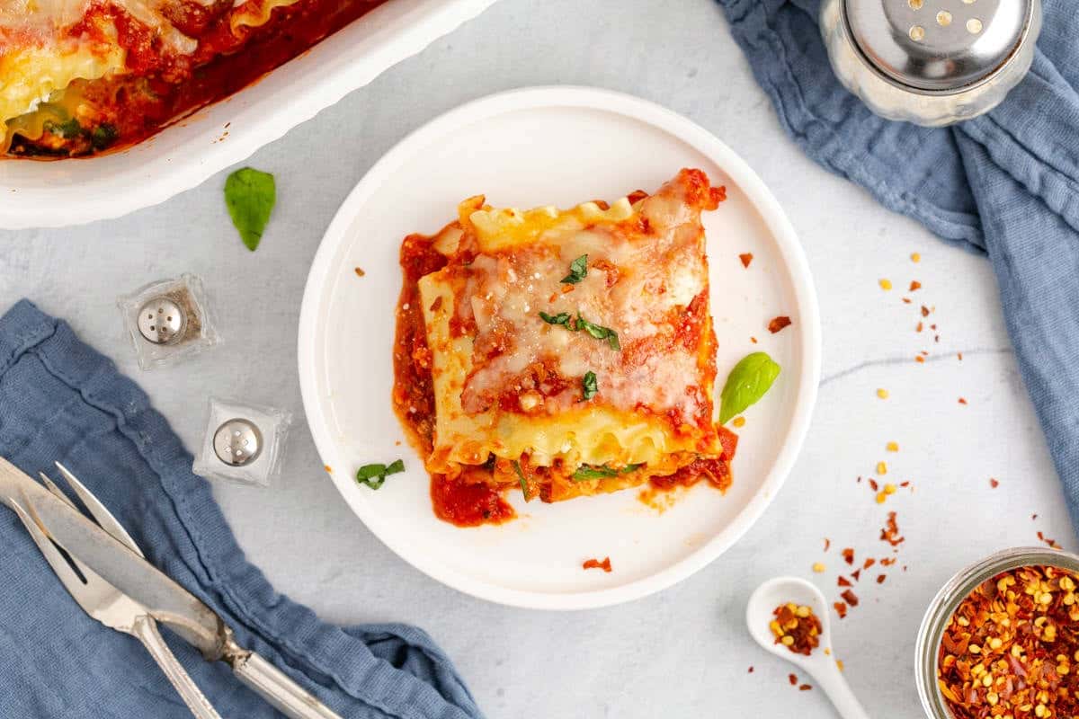 Spinach Lasagna Roll Ups Topped with Fresh Basil on a Plate