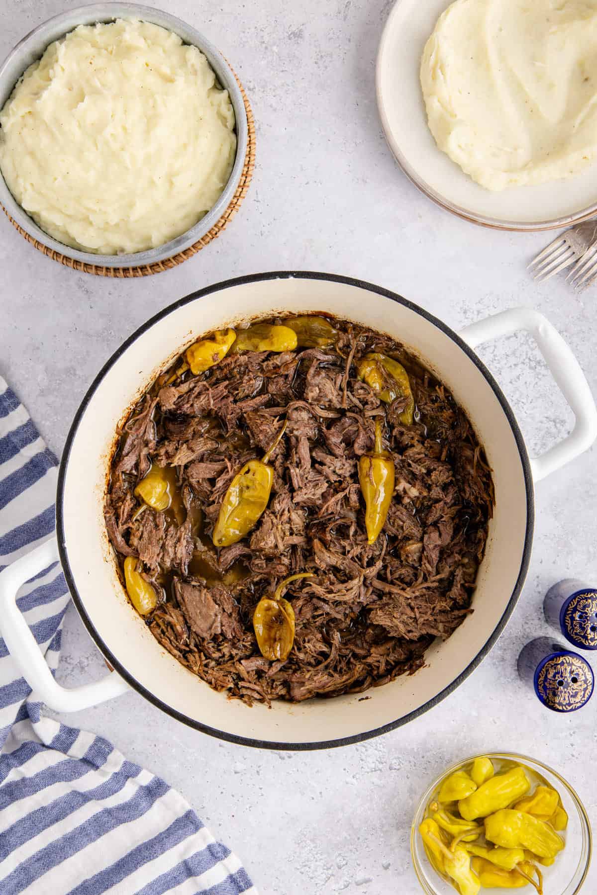 Mississippi Pot Roast shredded in a Dutch oven from above