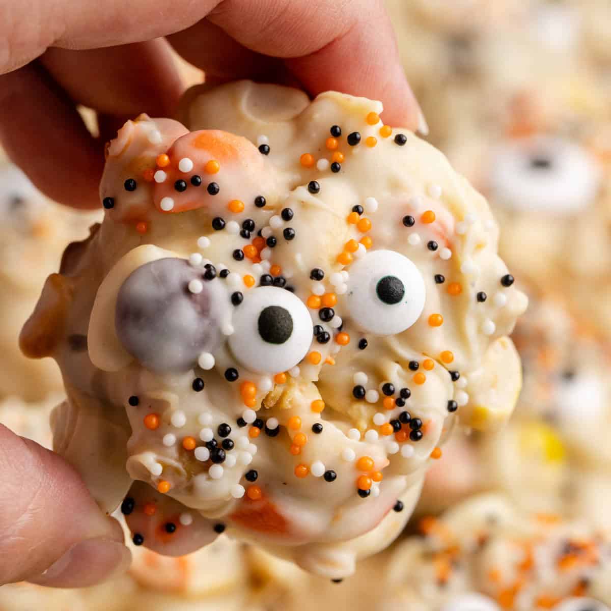 Halloween Crock Pot Candy cluster with googly eyes and festive sprinkles