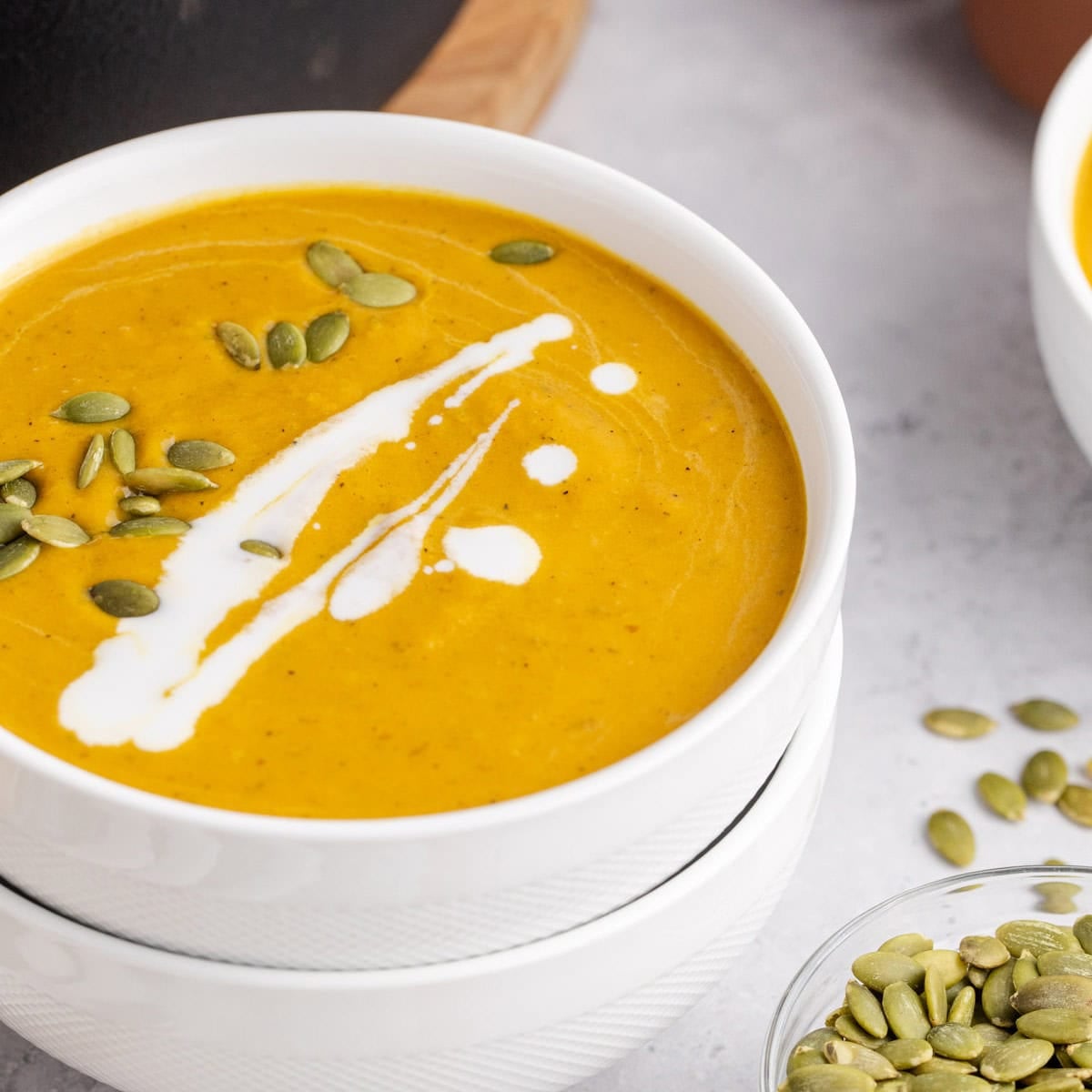 Pumpkin Carrot Soup in a bowl close up