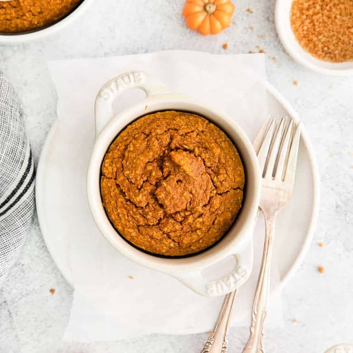 Baked Pumpkin Pie Oatmeal on a plate with forks