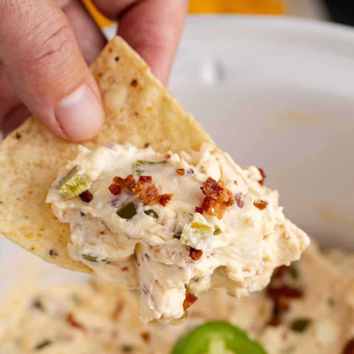 25 Quick and Easy Game Day Appetizers Slow Cooker Jalapeño Popper Dip on a Chip