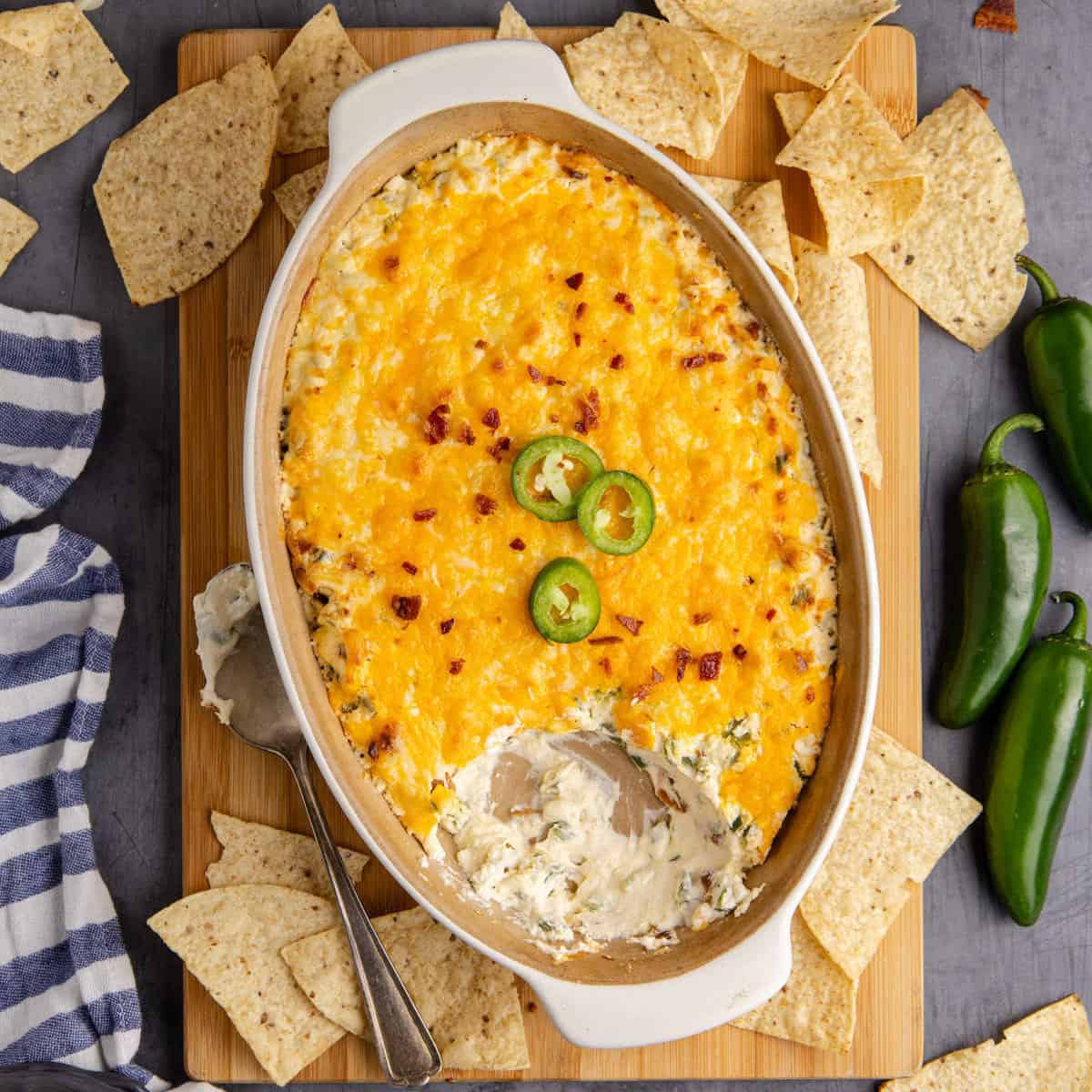 25 Quick and Easy Game Day Appetizers Jalapeño Popper Dip from overhead with chips all around