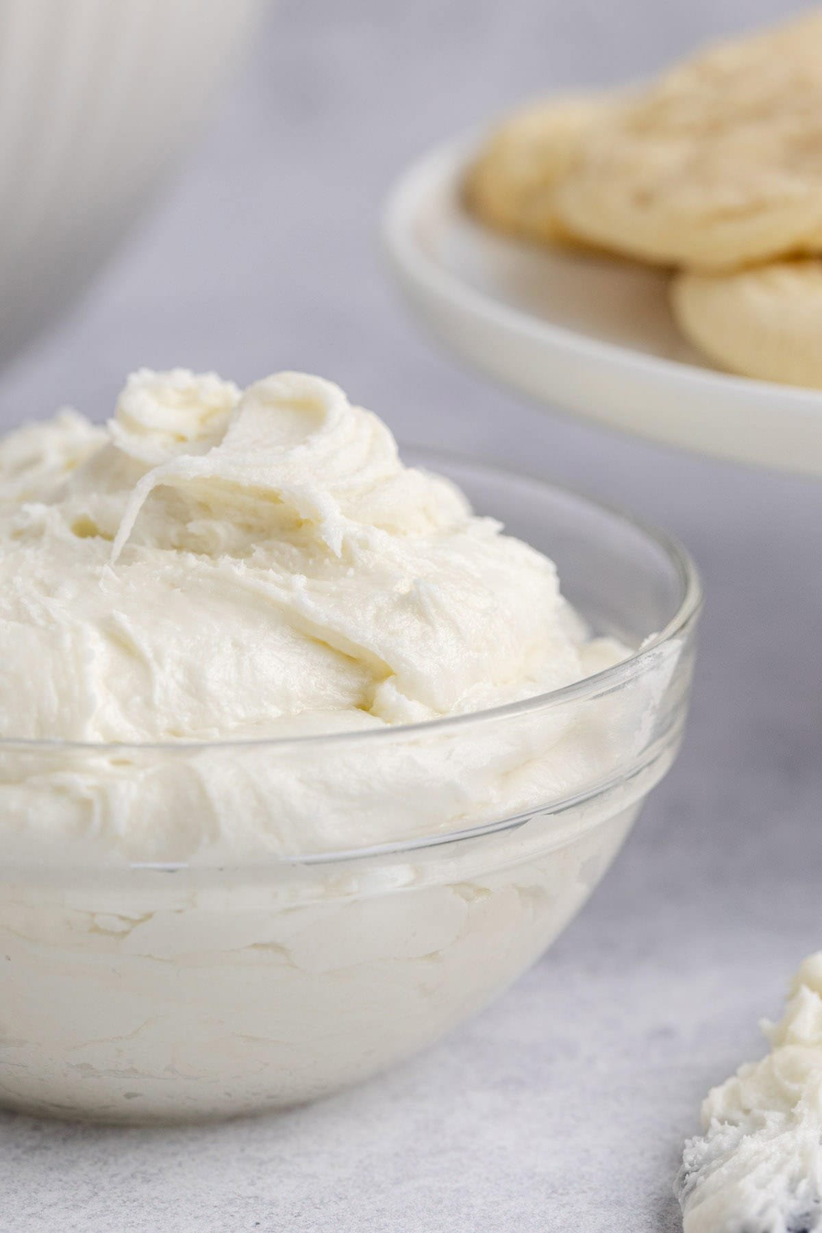 Buttercream Frosting for Sugar Cookies in a Small Glass Bowl Close Up