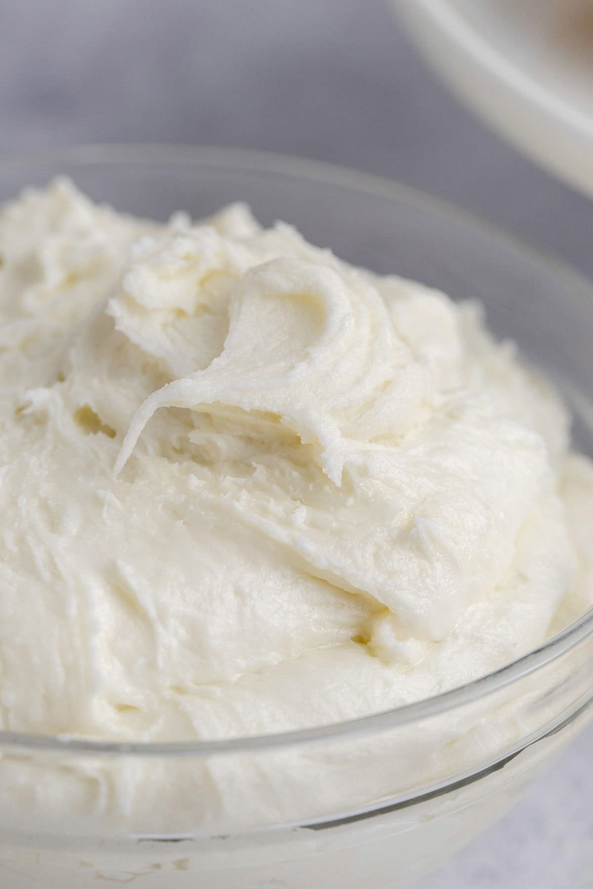 Buttercream Frosting for Sugar Cookies in a Small Glass Bowl Close Up