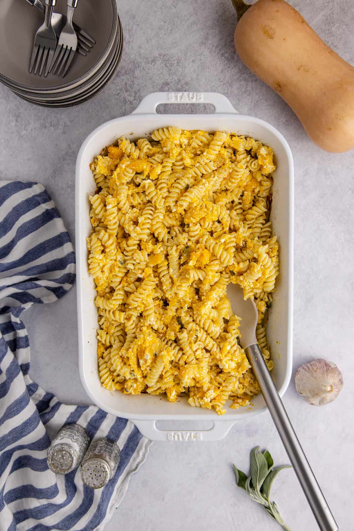 Butternut Squash Feta Pasta overhead with a serving spoon it in on a counter