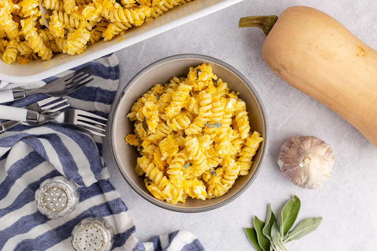 Butternut Squash Feta Pasta from overhead in a bowl with sage on top