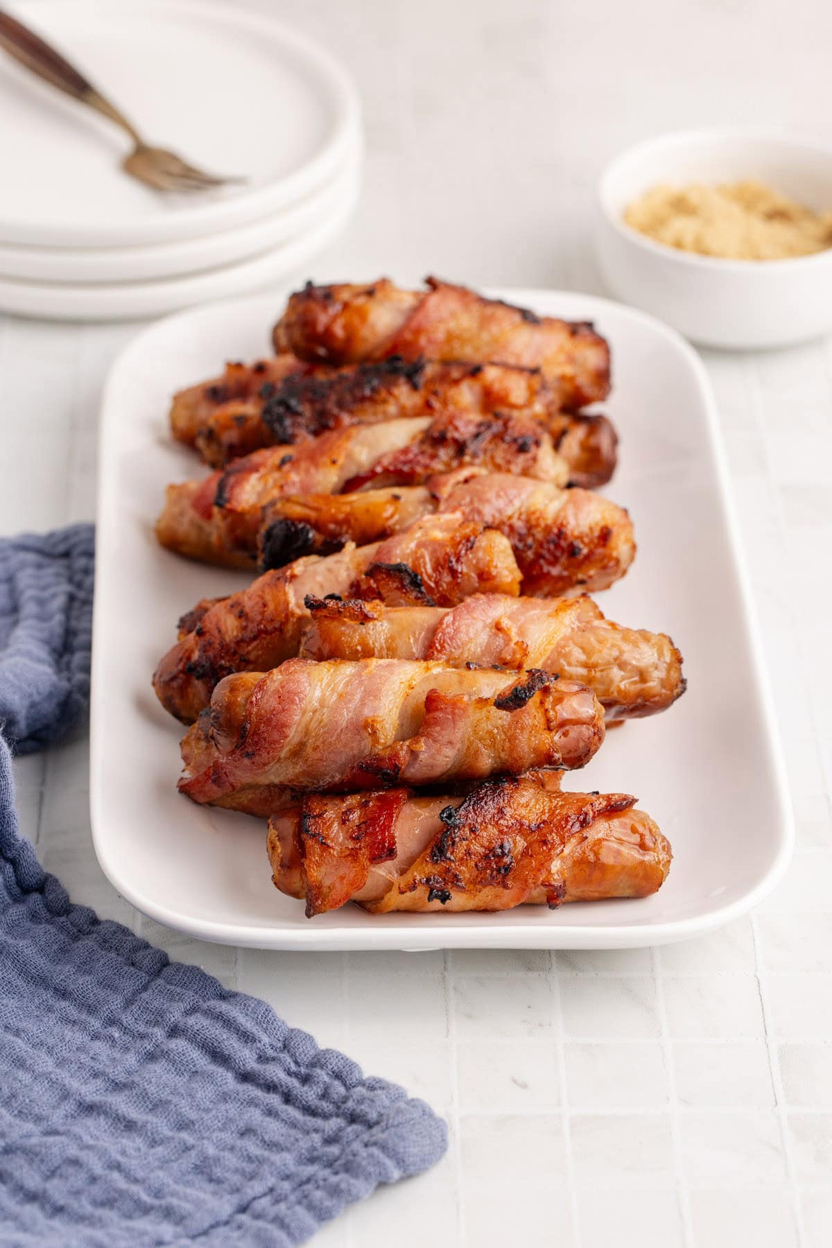 Bacon Wrapped Sausages Served on a Long Platter