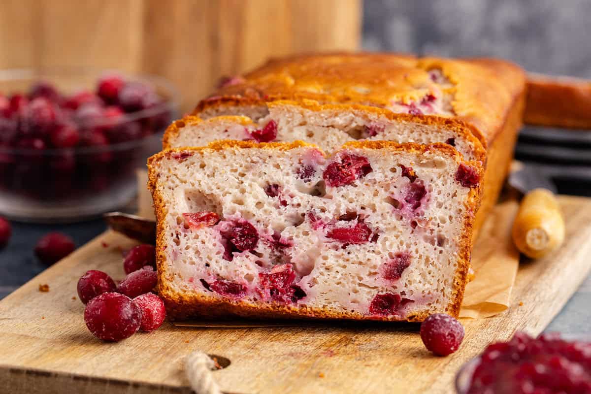 Cranberry Sauce Bread on a cutting board sliced
