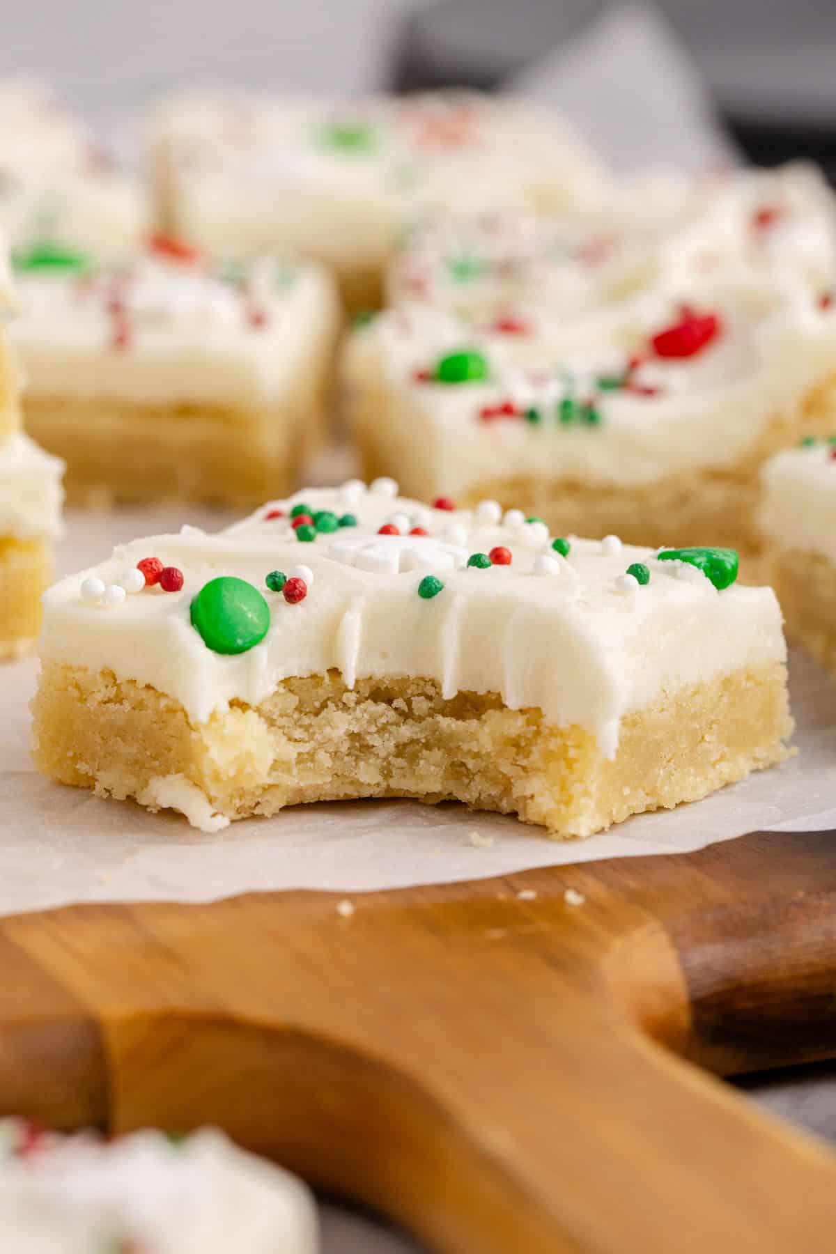 Frosted Sugar Cookie Bars with a bite mark