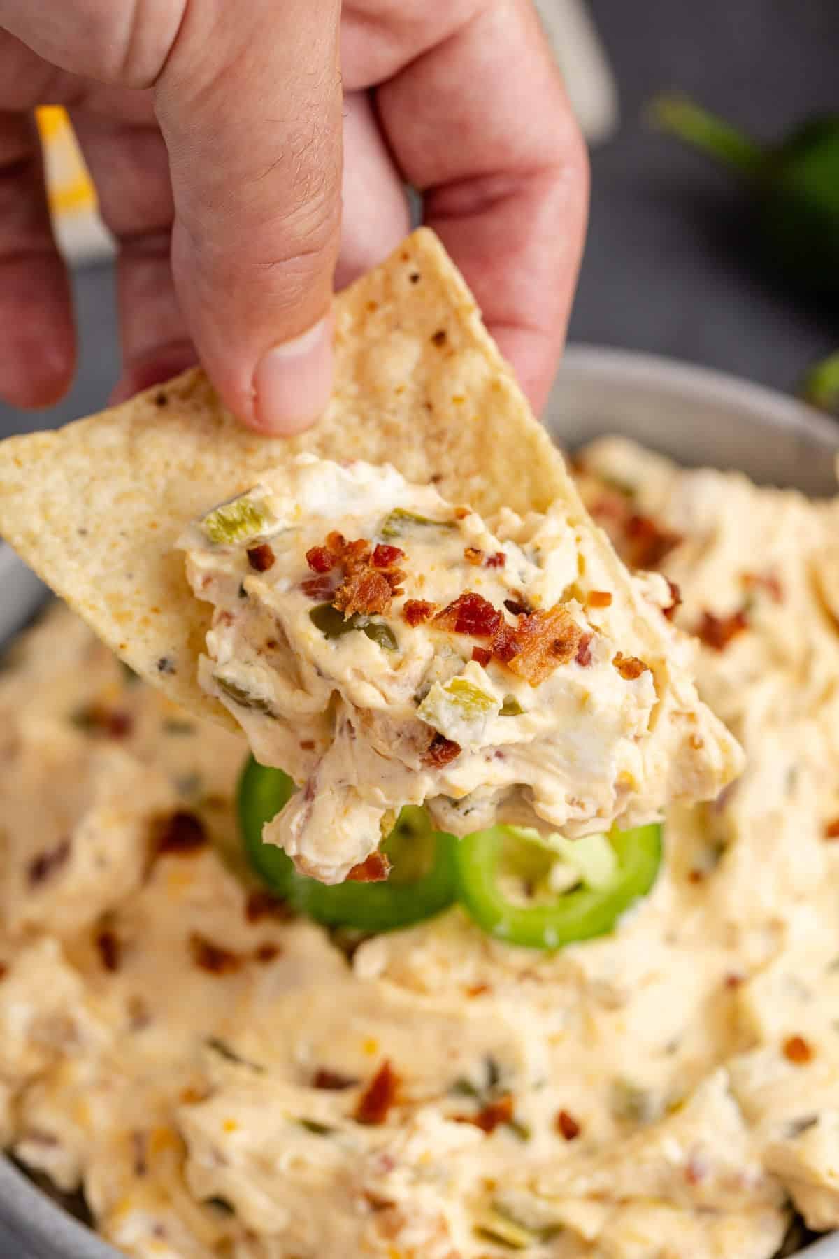 Tortilla Chip Scooping Jalapeno Cream Cheese Dip