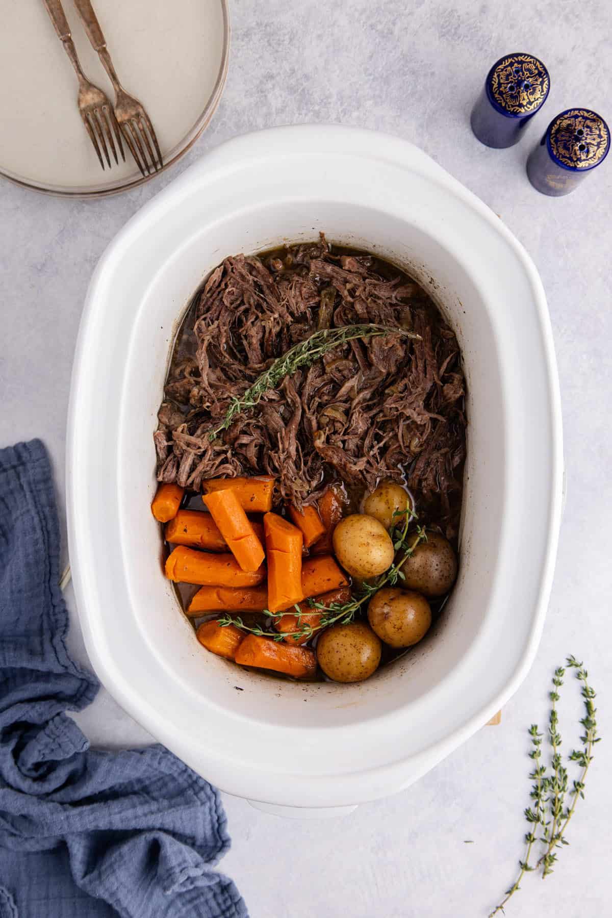 Pot Roast Slow Cooker Recipe shredded in a Crockpot from above
