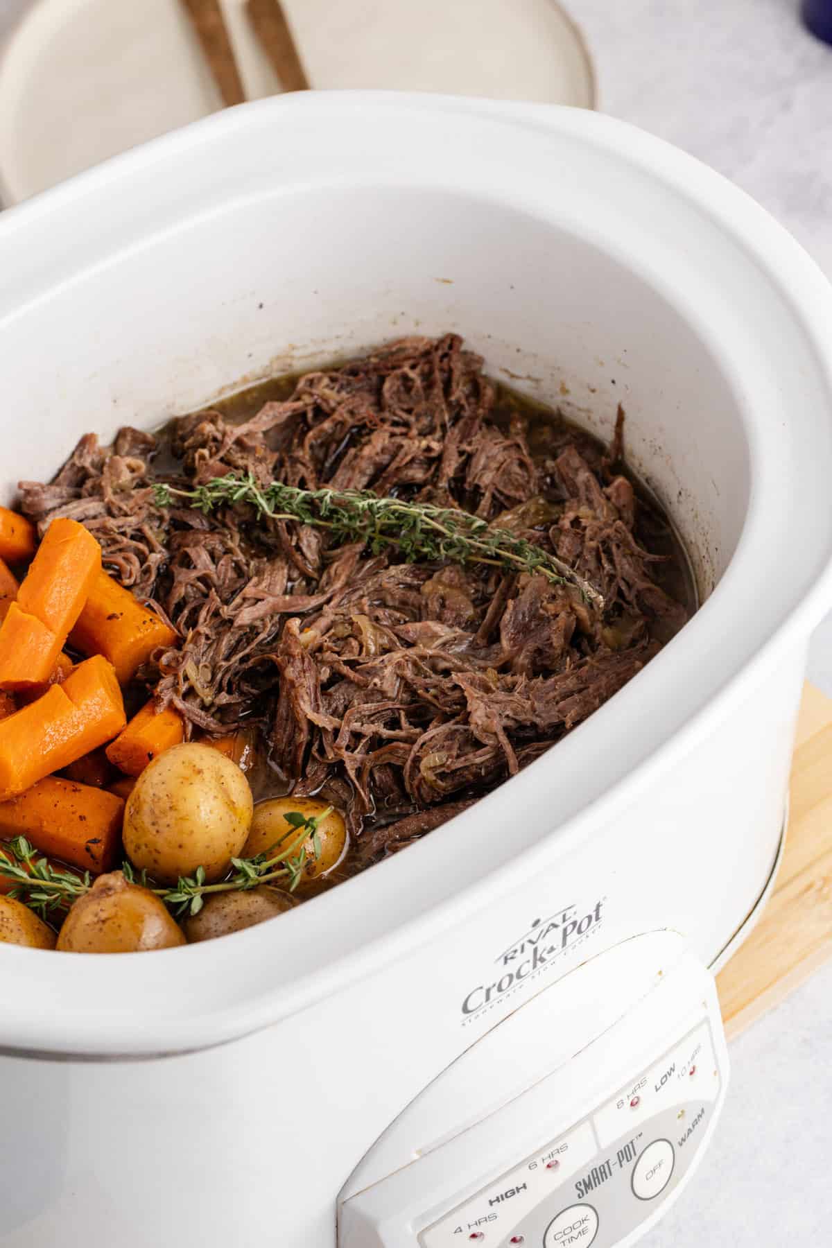 Pot Roast Slow Cooker Recipe shredded in a Crockpot close up