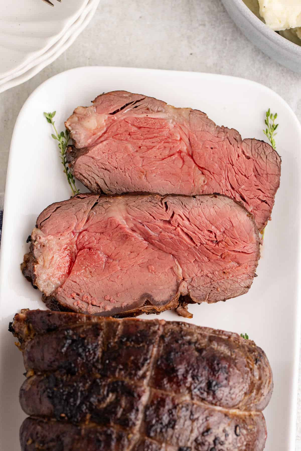 Reverse Sear Beef Tenderloin from above sliced on a platter