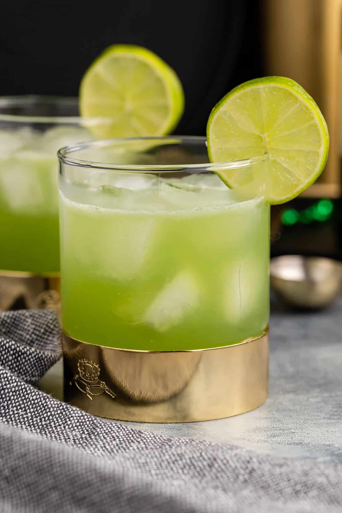 Shamrock Sour in Glasses with Limes