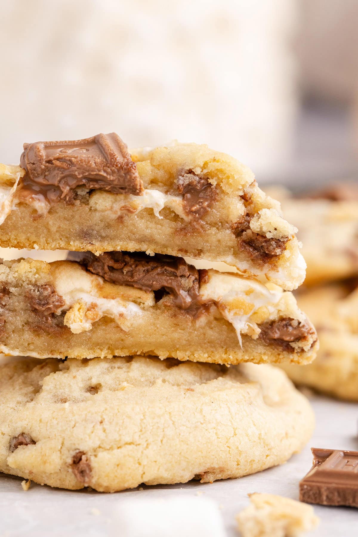 Smores Cookies stacked on top of each other and cut in half