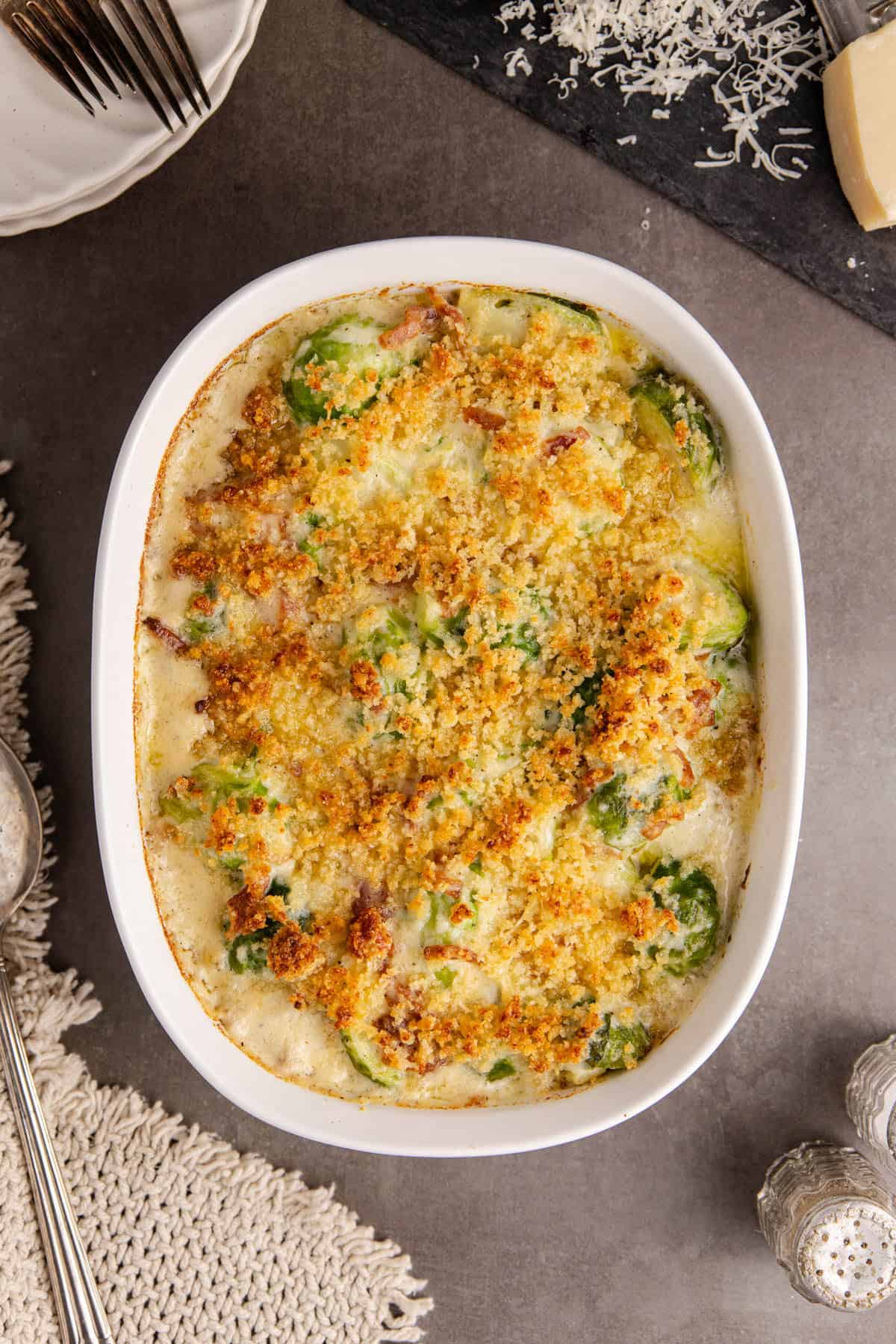 Brussels Sprouts Casserole with crispy topping on a counter in a pan