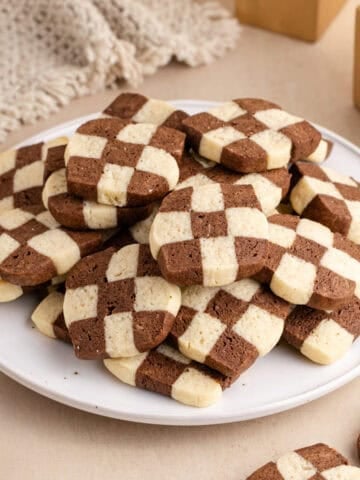 Checkerboard Cookies piled up on a plate