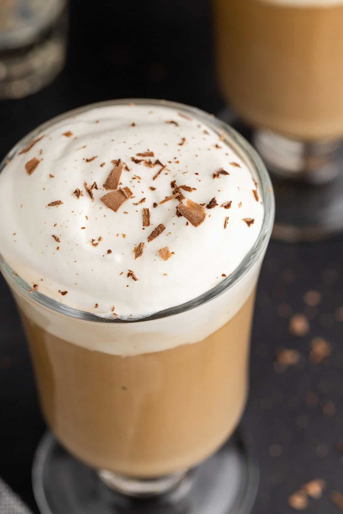Irish Coffee with Baileys Served in a Clear Mug with Whipped Cream and Chocolate Shavings