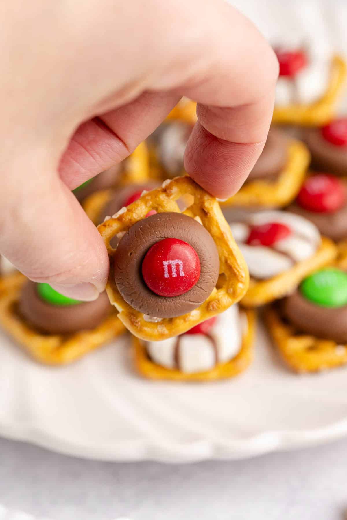 Christmas Pretzel Treat being picked up, up close