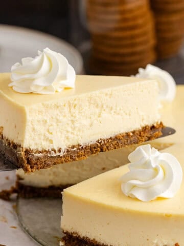 Eggnog Recipes Eggnog cheesecake slice being lifted up on a pie server