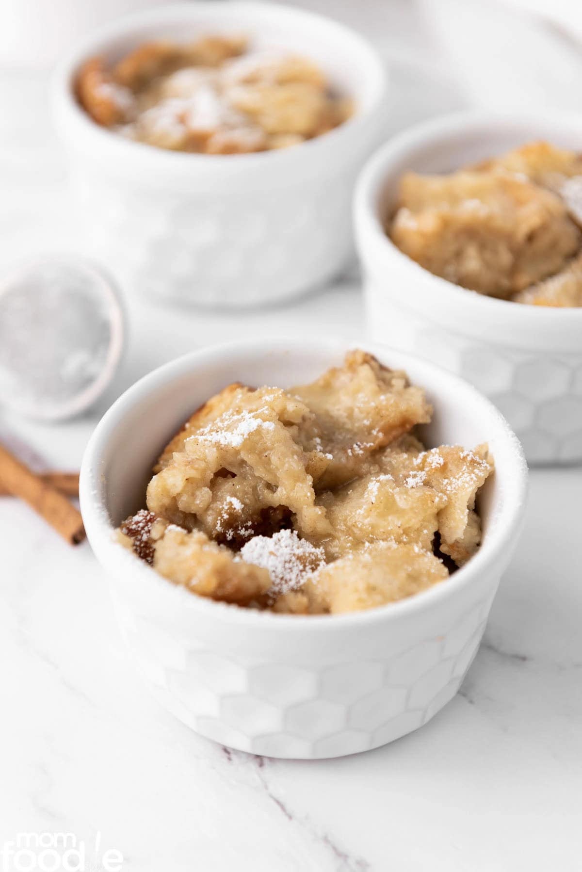 Eggnog Recipes Bread Pudding in small bowls on a counter