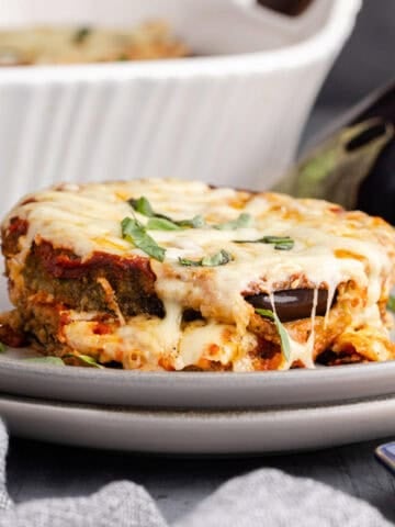 Eggplant Casserole on a plate with basil garnish